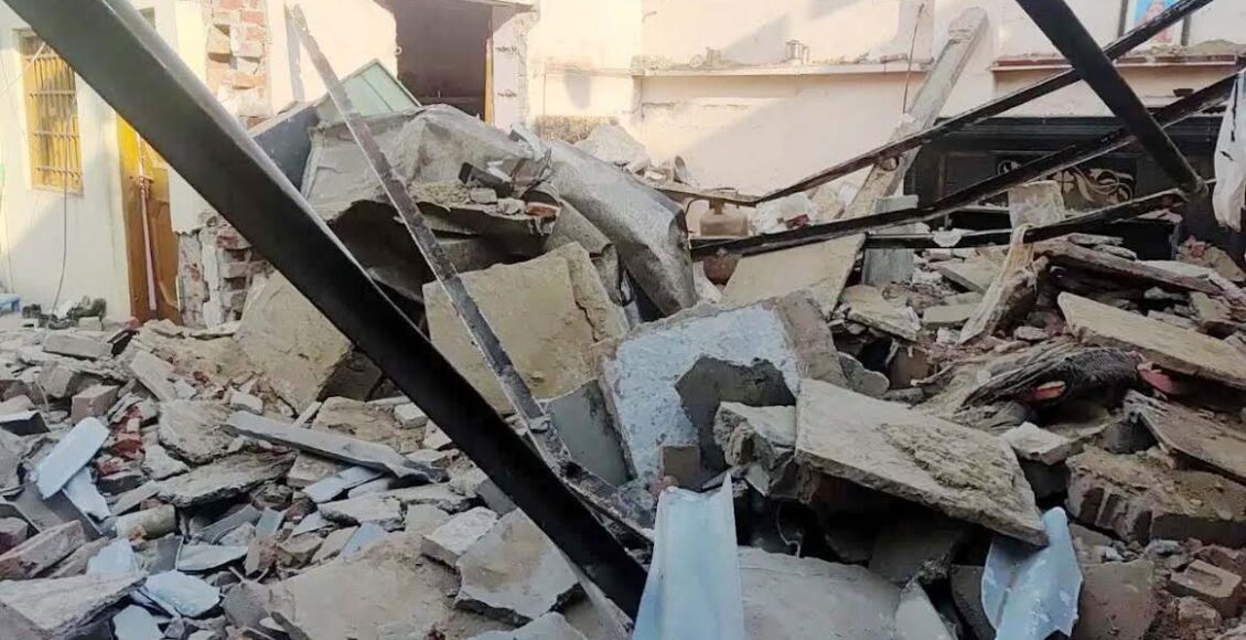 A cylinder exploded while cooking in a house, blowing off the roofs of two houses, injuring four.